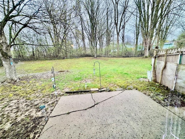 view of yard with fence and a patio