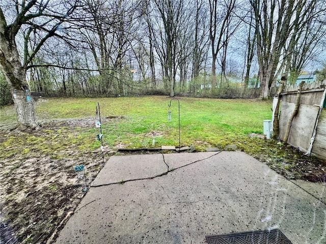 view of yard with fence and a patio area