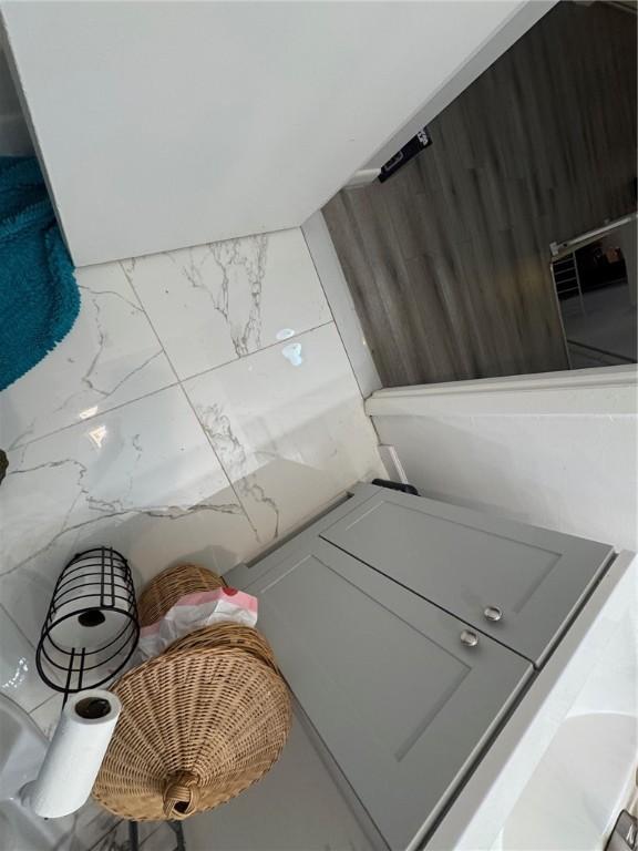 laundry room with marble finish floor