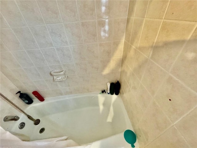 full bathroom featuring a bathing tub and walk in shower