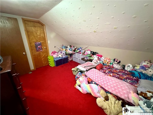 bedroom featuring vaulted ceiling and carpet flooring