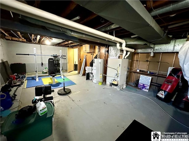 unfinished below grade area featuring heating unit and water heater