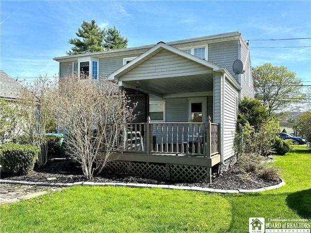view of front of home featuring covered porch and a front yard