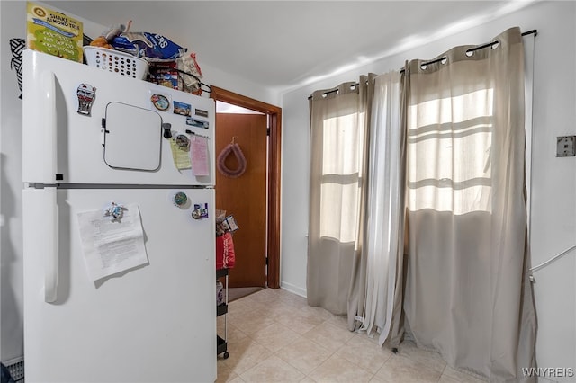 interior space featuring light tile patterned flooring