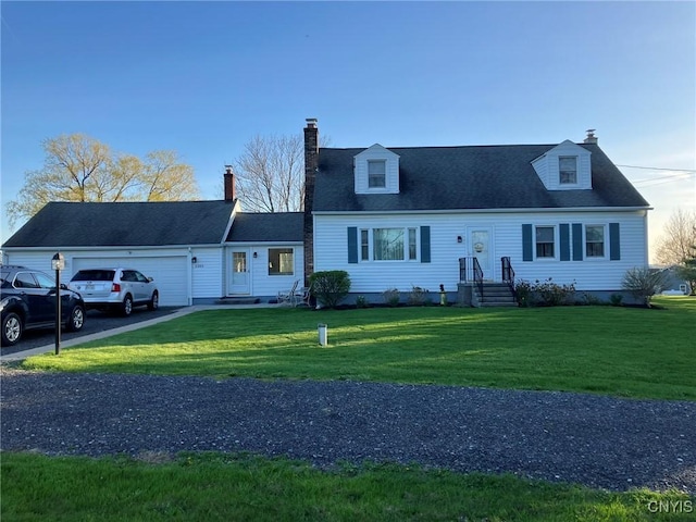 new england style home featuring a garage, a front lawn, and a chimney