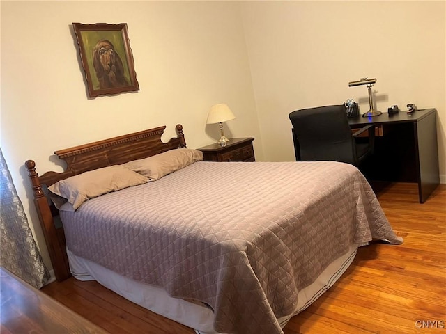 bedroom featuring wood finished floors