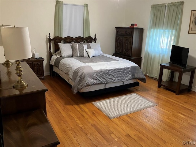 bedroom featuring wood finished floors