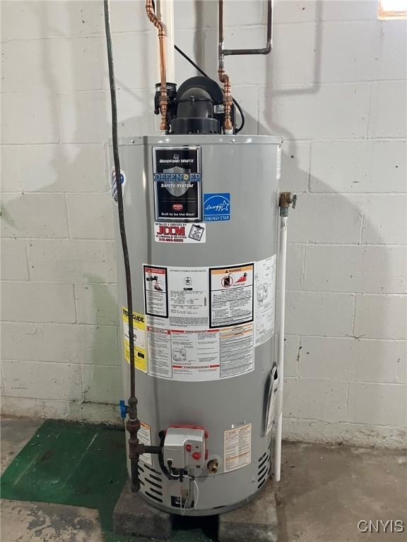 utility room with gas water heater