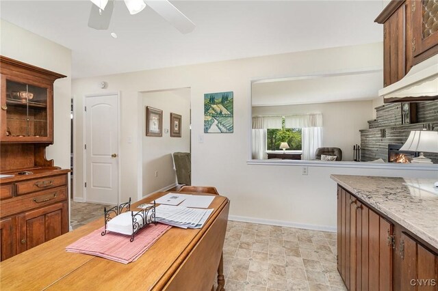 2203 State Route 90th Rd, Ledyard, NY 13026 - office space featuring a ceiling fan, a lit fireplace, and baseboards