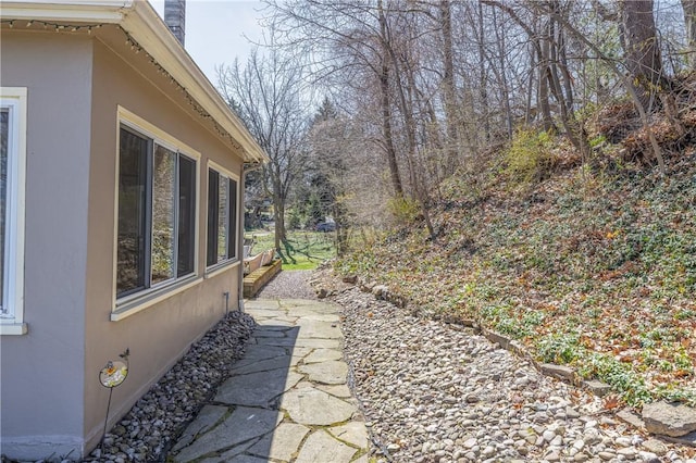 view of property exterior with stucco siding