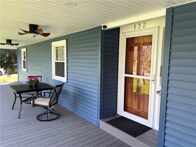 deck featuring a ceiling fan and outdoor dining area
