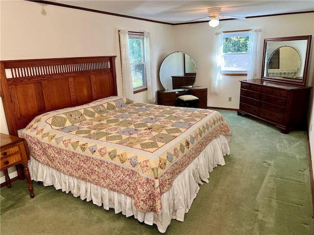 bedroom featuring crown molding, ceiling fan, multiple windows, and carpet
