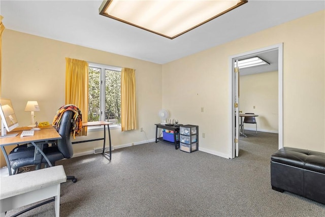 carpeted office featuring baseboards
