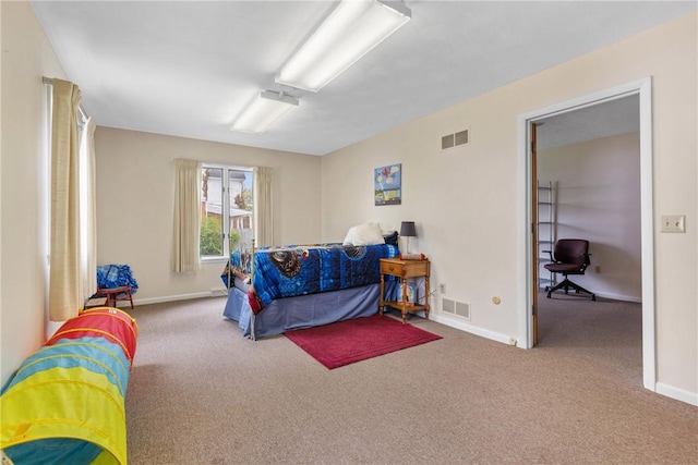 bedroom featuring visible vents, baseboards, and carpet floors