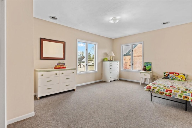 carpeted bedroom with baseboards and visible vents