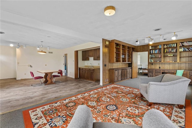 living area featuring track lighting, pool table, and wood finished floors