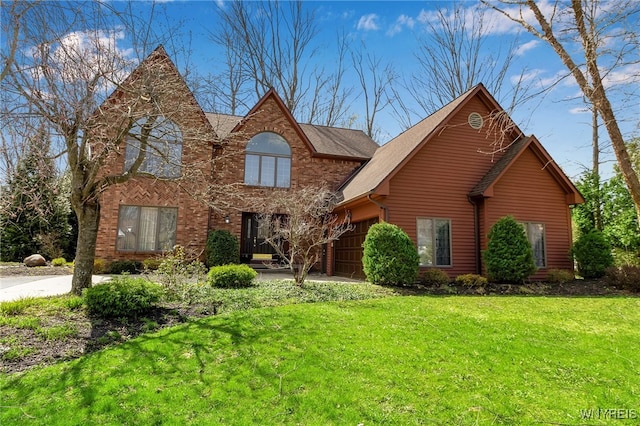 traditional home with a garage and a front lawn