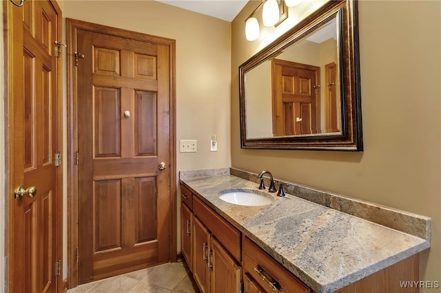 bathroom featuring tile patterned floors and vanity