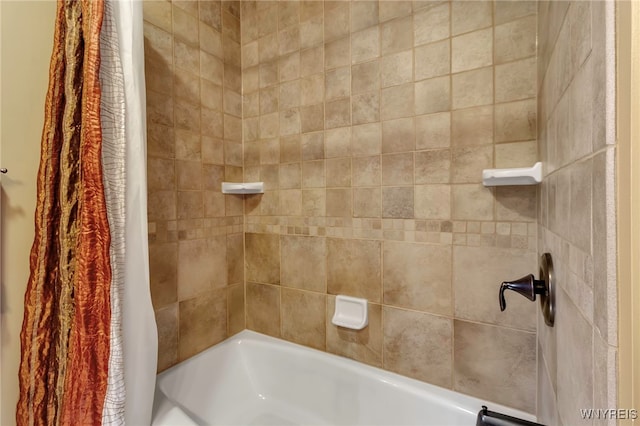 bathroom with shower / bath combination with curtain