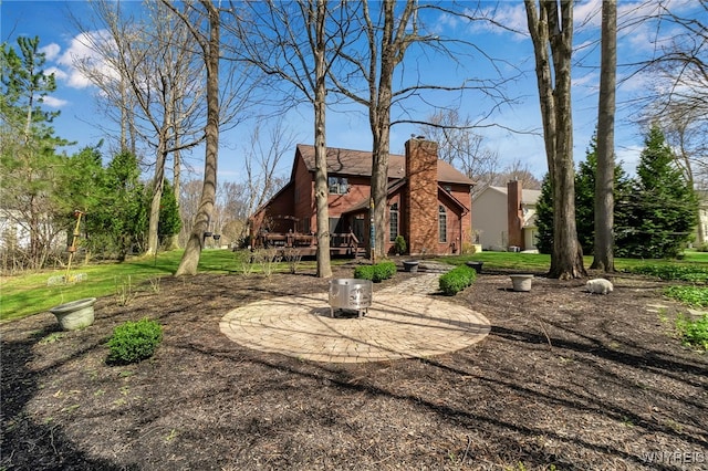 rear view of property with a chimney