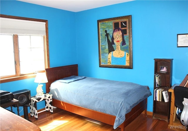 bedroom with wood finished floors