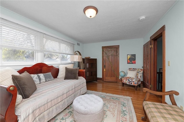 living room featuring wood finished floors and visible vents