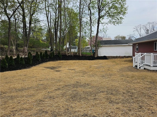 view of yard featuring a wooden deck