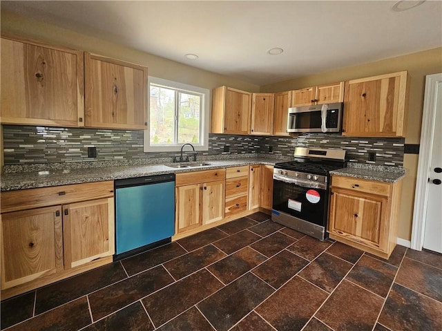 kitchen featuring a sink, light brown cabinets, and stainless steel appliances