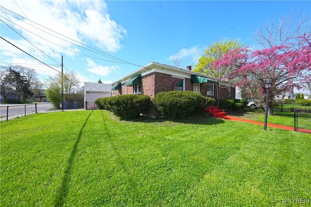 view of side of property with fence, a chimney, a yard, and brick siding