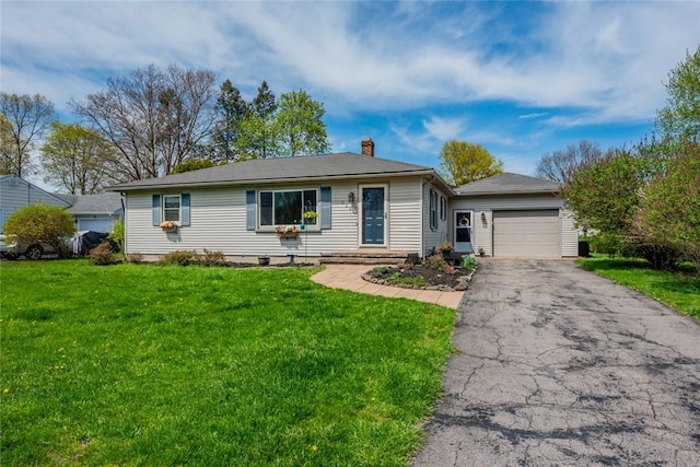 single story home featuring a garage, a chimney, driveway, and a front yard