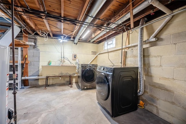 clothes washing area with washing machine and clothes dryer and laundry area