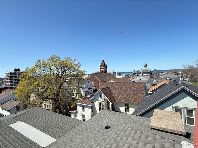 exterior details with roof with shingles