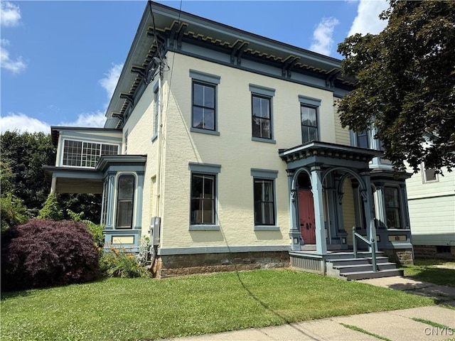 118 E 3rd St, Oswego, NY 13126 - italianate-style house featuring a front yard and a porch
