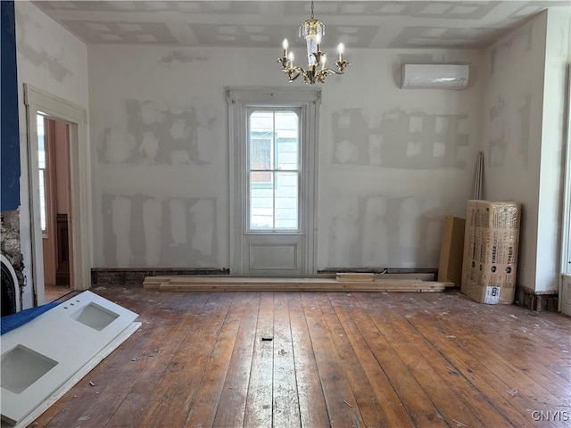 118 E 3rd St, Oswego, NY 13126 - unfurnished dining area featuring a wall unit AC, wood-type flooring, and a chandelier