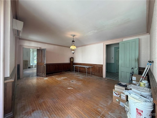 118 E 3rd St, Oswego, NY 13126 - empty room featuring hardwood / wood-style floors, wainscoting, and ornamental molding