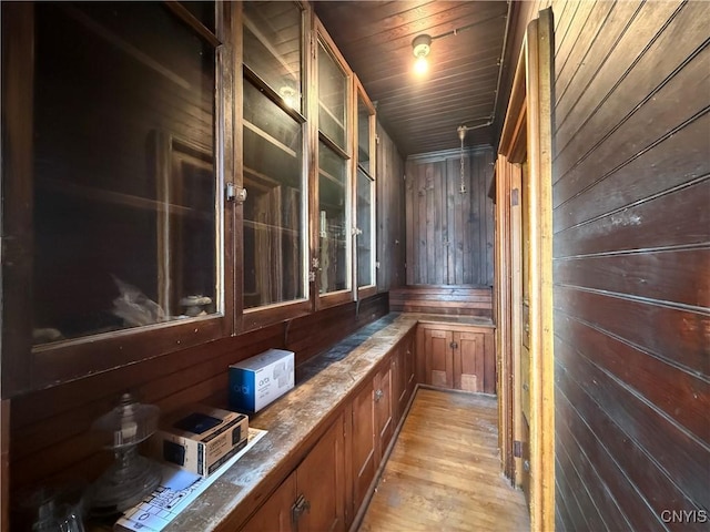 118 E 3rd St, Oswego, NY 13126 - bar with wood walls and light wood-type flooring