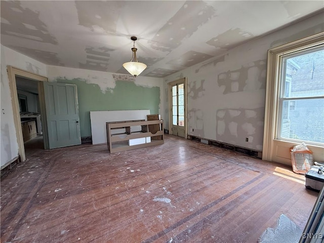 118 E 3rd St, Oswego, NY 13126 - unfurnished dining area featuring wood finished floors