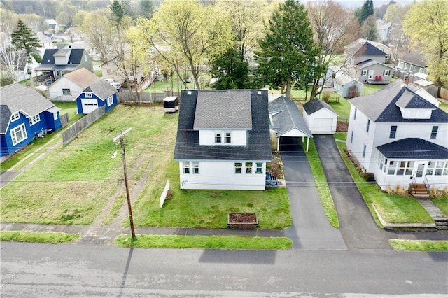 birds eye view of property with a residential view