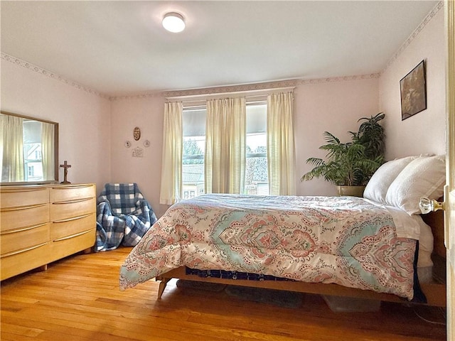 bedroom featuring wood-type flooring