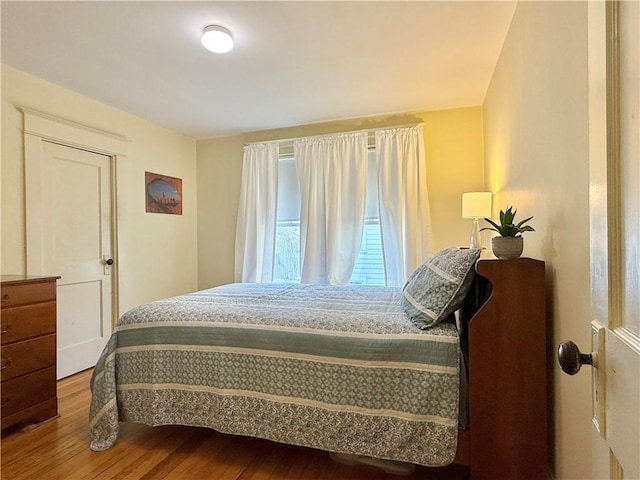 bedroom featuring wood finished floors
