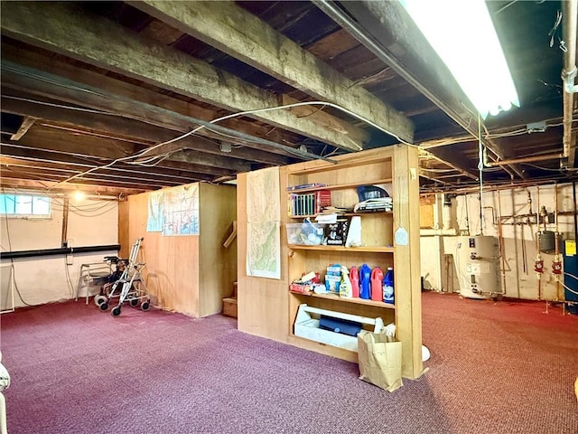 basement with water heater, carpet floors, and plenty of natural light