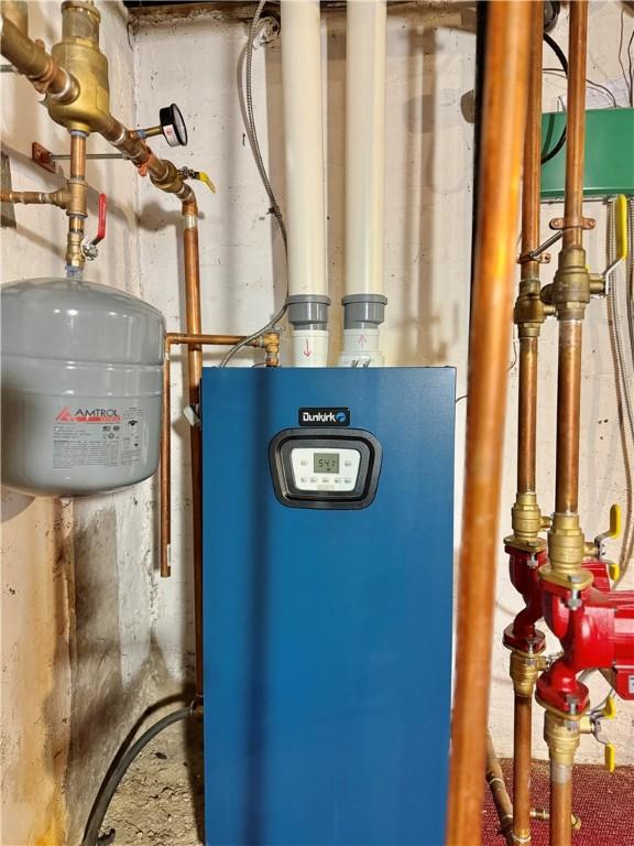 utility room featuring water heater