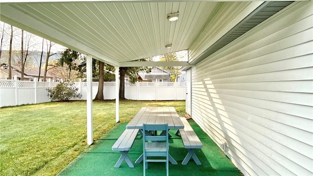 view of patio with fence and outdoor dining area