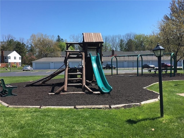community play area featuring a lawn