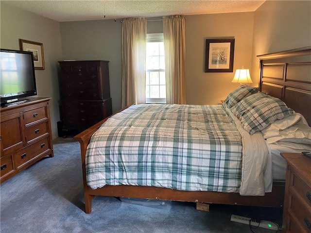 carpeted bedroom featuring a textured ceiling