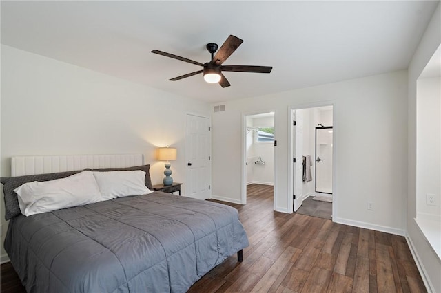 bedroom with ceiling fan, baseboards, ensuite bathroom, dark wood-type flooring, and visible vents