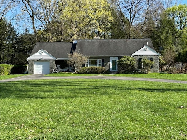 view of front of home with an attached garage, a front lawn, aphalt driveway, and stone siding