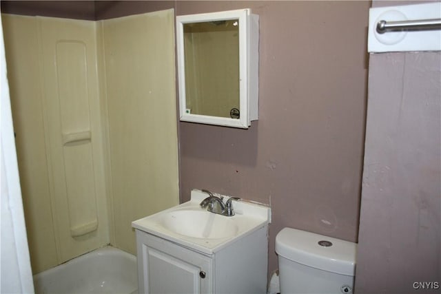 bathroom with toilet and vanity
