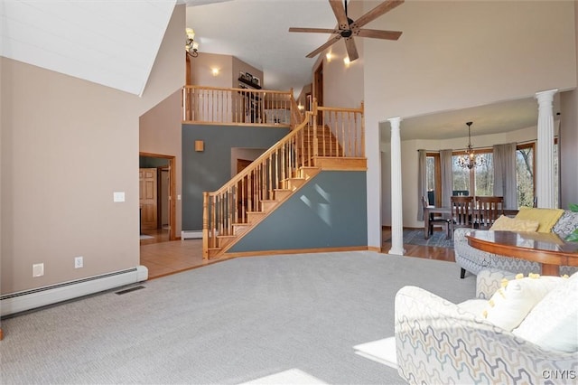 living room featuring high vaulted ceiling, a baseboard heating unit, ornate columns, and stairs