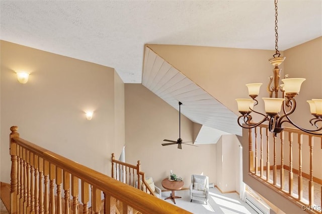 hallway featuring carpet floors, a chandelier, baseboards, an upstairs landing, and vaulted ceiling